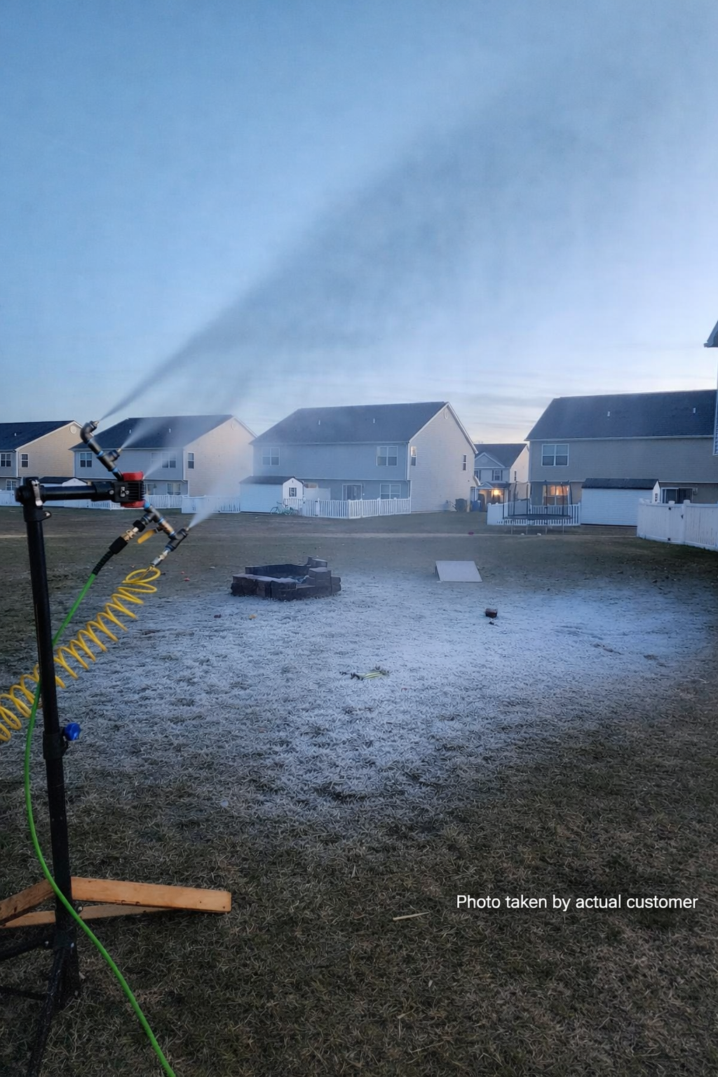 ATV-mounted snowmaking equipment spraying from elevated platform