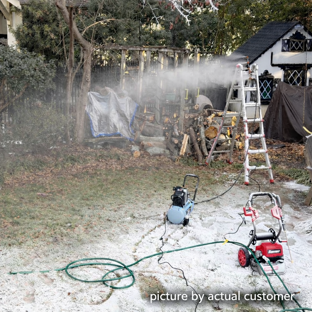 Wide backyard snowmaking session with equipment in action